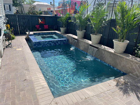 Raised Hot Tub and Shallow Pool with Built-in Waterfall Features